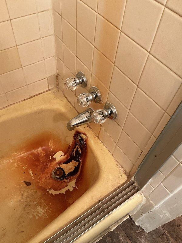 Completed replacement of three handle shower valves in bathroom with visible corrosion damage around tub drain area. Additionally, installed two new lavatory faucets and replaced angle stops to address aging fixtures showing significant wear and staining. All parts were pre-ordered, delivered to shop, and installation was completed as scheduled with photo documentation of deteriorated original fixtures.
