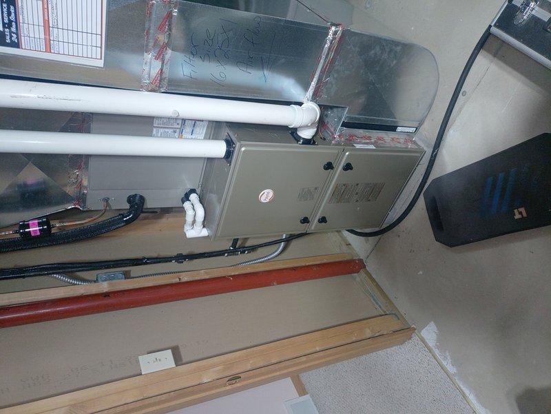 Performed routine maintenance on gas furnace of undetermined age. Inspected and cleaned blower wheel assembly to ensure proper operation. Verified MVP (motor, valve, pressure) components functioning correctly and inspected ductwork connections and PVC venting system for integrity.