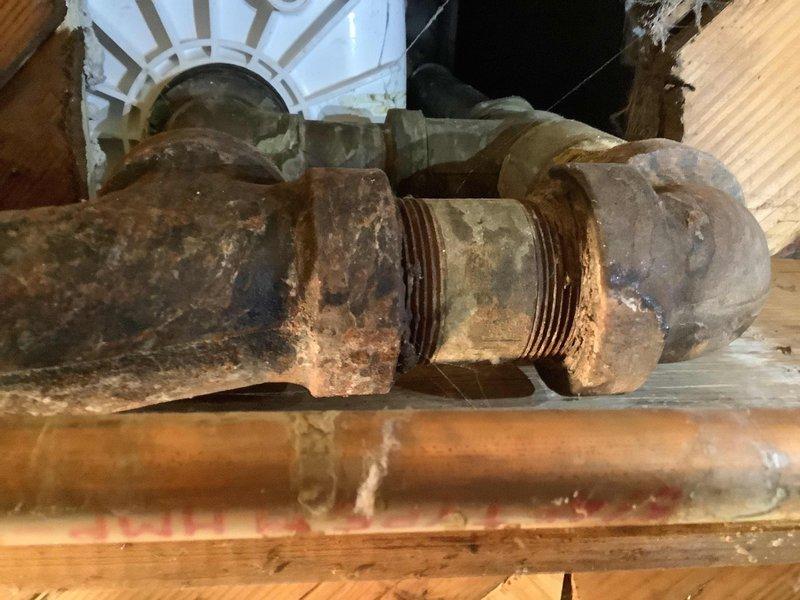 Performed service call at 70-year-old residence with clogged bathroom tub. Inspection revealed heavily corroded iron pipes with significant rusting at threaded connections and coupling joints, likely contributing to drainage issues. Successfully cleared the clog and advised customer about the deteriorating plumbing infrastructure that may require replacement in the future to prevent recurring problems.