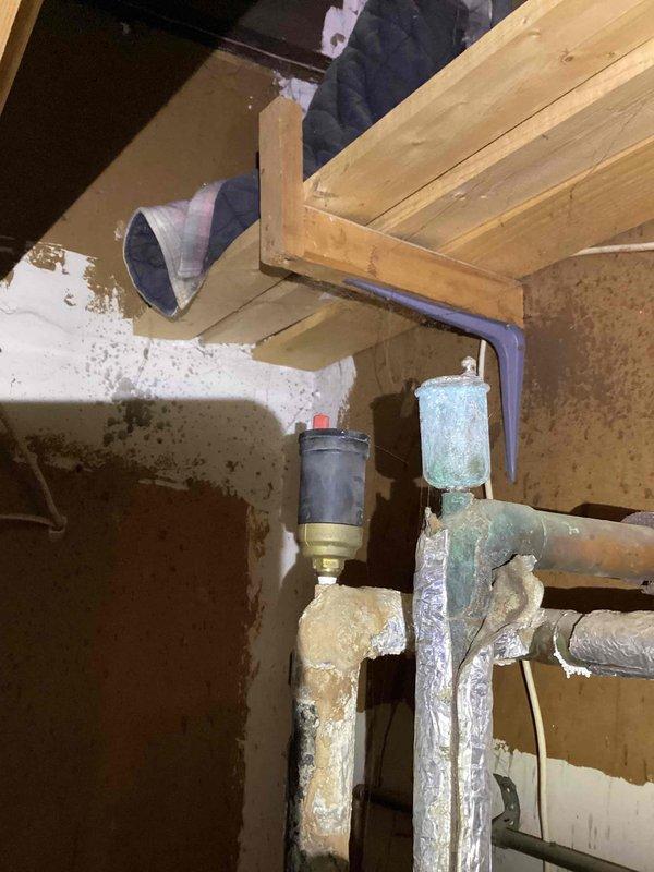 Responded to no-heat call for a 10-year-old furnace system. Diagnosed corroded gas line connections and oxidized copper piping in the utility area. Replaced gas valve, cleaned corroded fittings, and restored proper heating function after comprehensive system test.