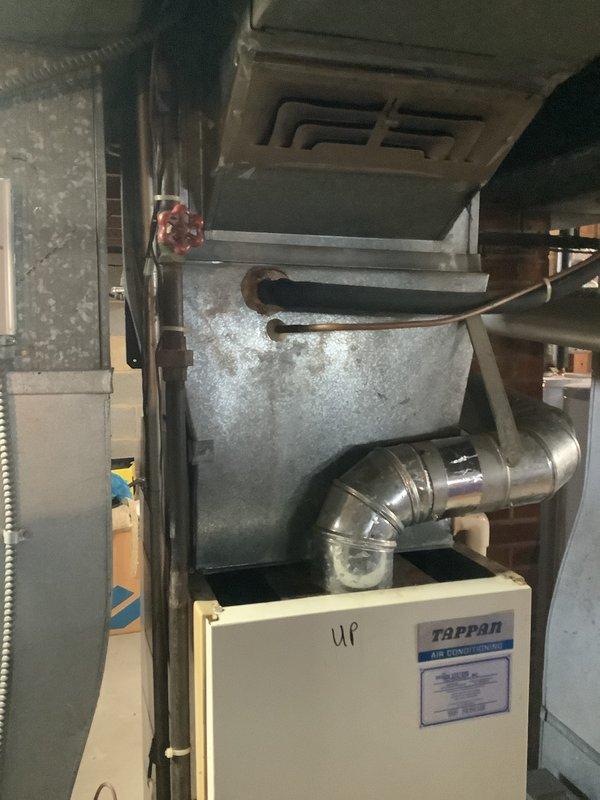 Conducted comprehensive furnace replacement consultation and assessment in basement utility area. Documented existing HVAC system including Tappan air conditioning unit with connected galvanized plenum, copper refrigerant lines, and ductwork configuration. Provided detailed estimate for complete system replacement based on structural constraints and current installation parameters.