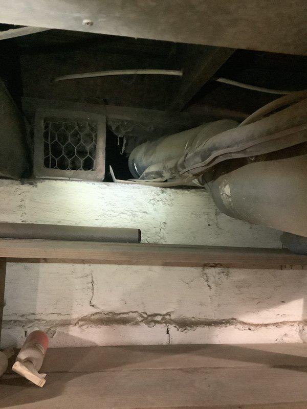 Conducted comprehensive assessment of 15-year-old HVAC system, including Carrier furnace unit and associated ductwork in basement utility area. Noted significant wall cracking near ventilation components and aging equipment condition. Provided replacement estimate for complete furnace and AC system upgrade with documentation of current installation configuration.