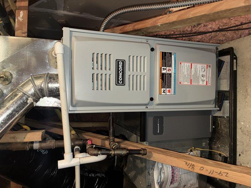 Performed routine heating maintenance on Concord furnace system for MVP customer. Inspected unit connections, including metal ductwork, PVC ventilation pipes, and copper lines. Verified proper installation of flexible metal conduit and checked condition of ductwork joints and metallic tape seals in attic space.