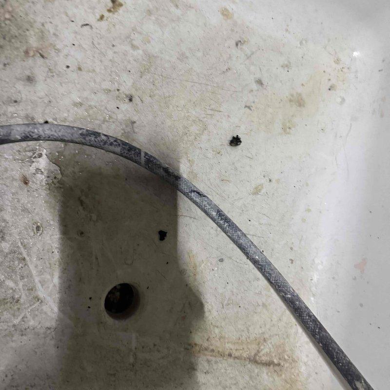 Responded to service call for a 4-year-old furnace leaking water onto carpet. Upon inspection, found humidifier with clogged filter element and drain line issues causing the water leak. Cleaned filter, cleared drainage system, and verified proper operation of unit before departure.