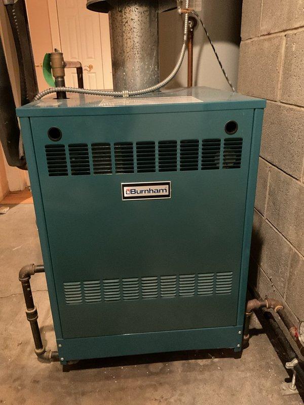 Performed scheduled maintenance on Burnham boiler system. Inspected pressure gauge readings and verified proper operation of all components. System is functioning correctly with no issues identified.