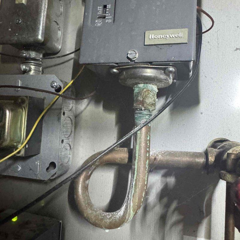 Performed routine furnace tune-up as requested with no existing issues found. Inspected plumbing components including PVC pipes and connections which appeared intact. Examined Honeywell control unit and noted copper piping with oxidation that may require future attention, though currently functioning properly.