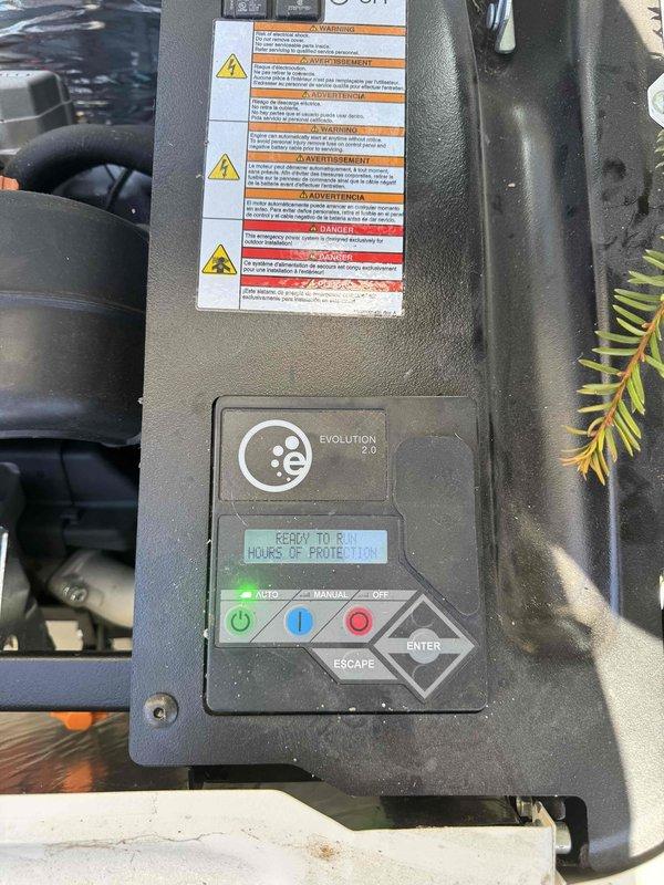 Performed routine maintenance on a 4-year-old Generac residential generator with blinking maintenance light. Inspected control panel (Evolution 2.0 interface) and verified system displays "READY TO RUN" status. Checked electrical connections at the transfer switch and confirmed proper installation on concrete pad with appropriate clearance from house siding.