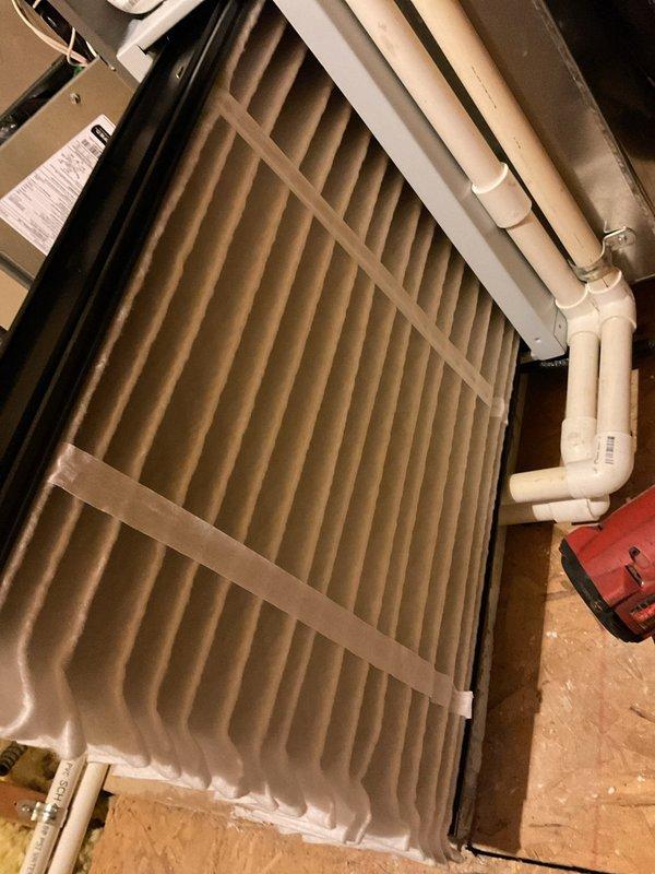 Performed scheduled heating maintenance service, which had been rescheduled from previous date. Inspected HVAC system including filter condition, which showed normal dust accumulation indicating proper filtration. Verified proper installation of PVC drainage components and completed system check using standard service tools.