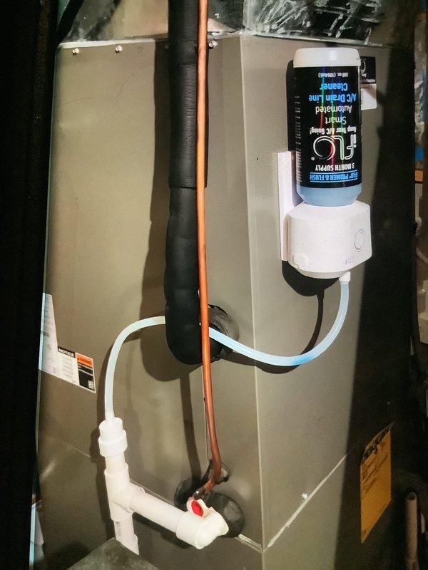 Performed routine MVP heating maintenance on system of unknown age. Inspected and documented condition of air handler unit, including condensate drain line, refrigerant piping, and digital control module. Examined blower wheel assembly which showed minor dust accumulation but remains in functional condition.