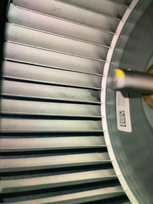 Performed routine MVP heating maintenance on system of unknown age. Inspected and documented condition of air handler unit, including condensate drain line, refrigerant piping, and digital control module. Examined blower wheel assembly which showed minor dust accumulation but remains in functional condition.