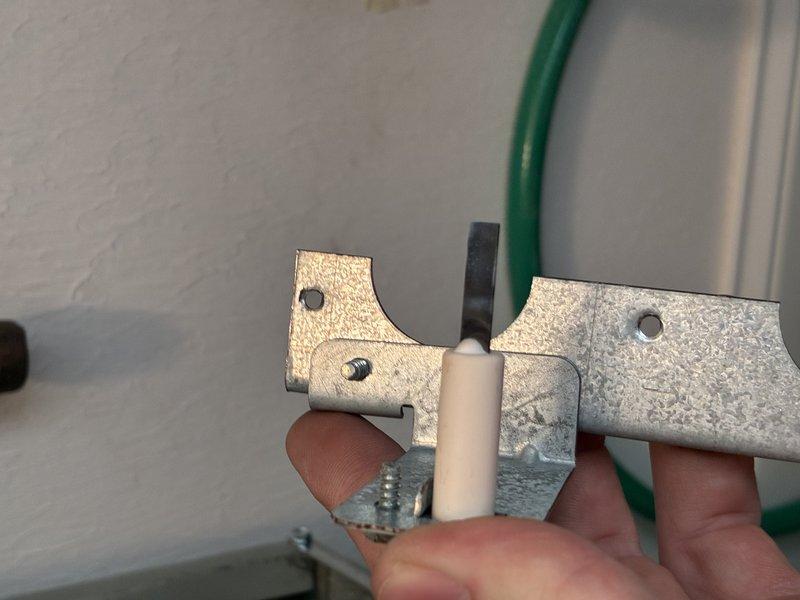 Performed comprehensive furnace tune-up including inspection and cleaning of ignition assembly. Removed and examined igniter electrode and flame sensor, finding light carbon buildup that was cleaned to restore proper operation. Also inspected and secured mounting bracket hardware to eliminate vibration issues, ensuring optimal system performance for the heating season.