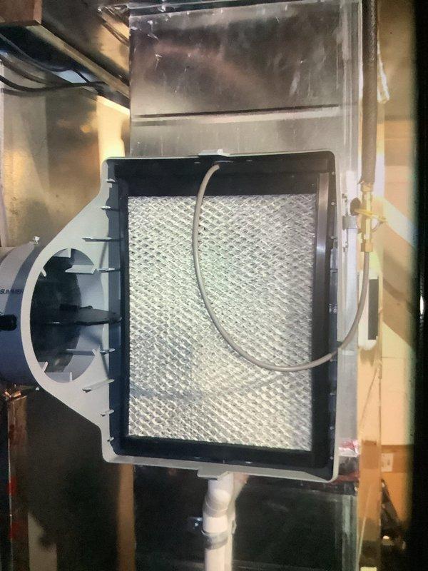 Performed scheduled MVP furnace maintenance with confirmed trip. Inspected air filter component and found normal working condition with no visible damage. Observed heat exchanger coils with notable frost accumulation and documented drain pan showing signs of rust and corrosion in the collection tray, which may require future attention.