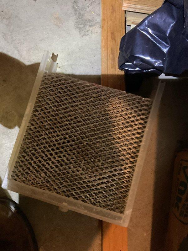 Performed scheduled MVP Cooling maintenance visit. Inspected residential HVAC system including furnace with PVC exhaust. Replaced air filter with visible accumulation of particulates, ensuring proper airflow for optimal cooling system operation.