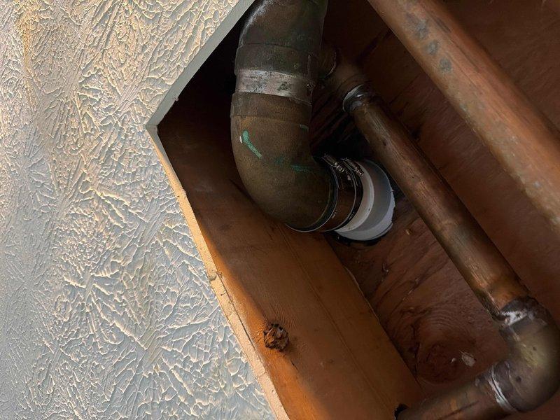 Completed repair service to address toilet drainage issues in customer's bathroom. Accessed ceiling below kitchen to cut out deteriorated toilet waste line, replaced damaged toilet flange, and reset toilet fixture. Restored proper drainage function and ensured secure toilet installation with no leaks.