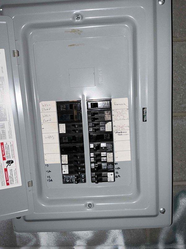Conducted site assessment for generator installation at church facility, documenting existing HVAC equipment (Lennox outdoor unit) and evaluating electrical panel capacity. Inspection of main breaker panel revealed adequate space for generator integration with labeled circuits including well pump and lighting systems. Photos taken of installation area and electrical panel for proper generator sizing and placement recommendations.