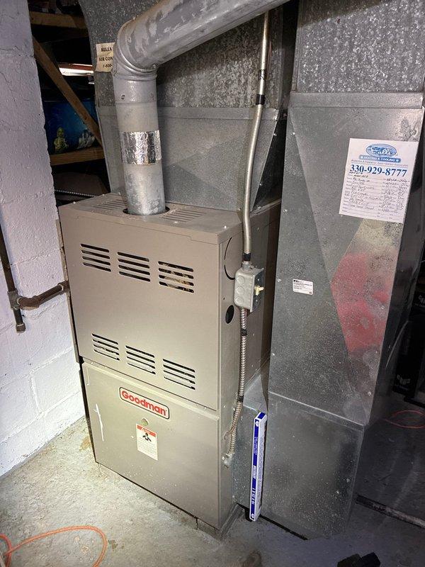 Performed standard maintenance on Goodman furnace system. Inspected flame sensor and cleaned component to ensure proper operation. Visual inspection of all ductwork connections, gas lines, and electrical wiring confirmed system is functioning correctly with no visible issues.