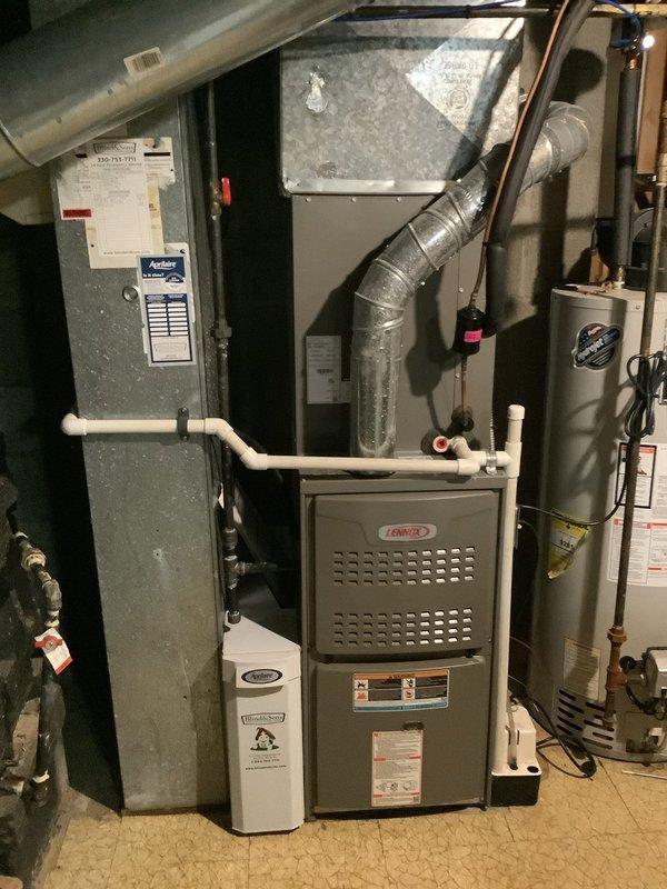 Performed scheduled maintenance visit for MVP customer's cooling system. Removed and cleaned evaporator coil assembly which showed significant dust accumulation along edges. Inspected complete Lennox HVAC system including furnace, ductwork, and connections to ensure proper operation and airflow.