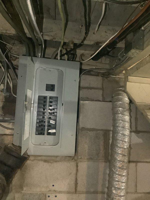 Completed installation of new AC circuit with proper electrical connections. Installed Diversitech disconnect box on exterior wall with conduit connections to the outdoor HVAC unit. Labeled corresponding circuit breakers in the main electrical panel for safety and service identification.