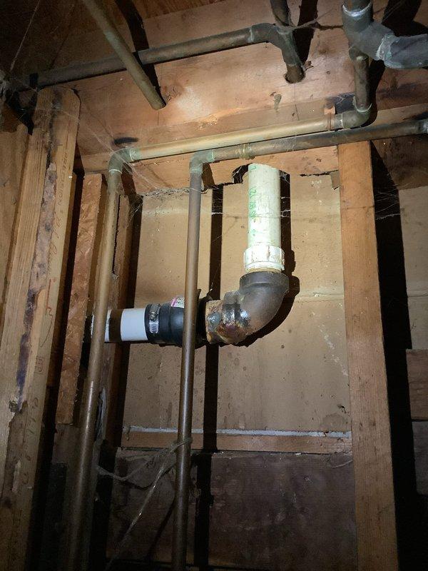 Responded to service call for recurring kitchen sink drain clog with additional drainage issues reported in basement. Inspection revealed aging P-trap with significant corrosion and mineral buildup in connected drain lines. Successfully cleared the immediate clog and recommended replacement of deteriorated plumbing components to prevent future blockages.