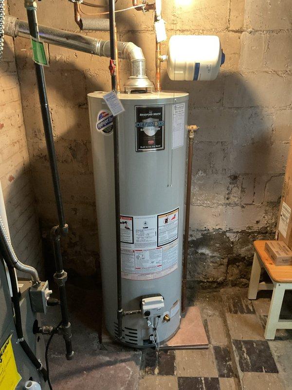 Performed scheduled maintenance service on tanked water heater system. Completed flush and fill procedure to remove sediment buildup and mineral deposits. Inspected associated components including expansion tank and ventilation system, confirming proper operation and connections.