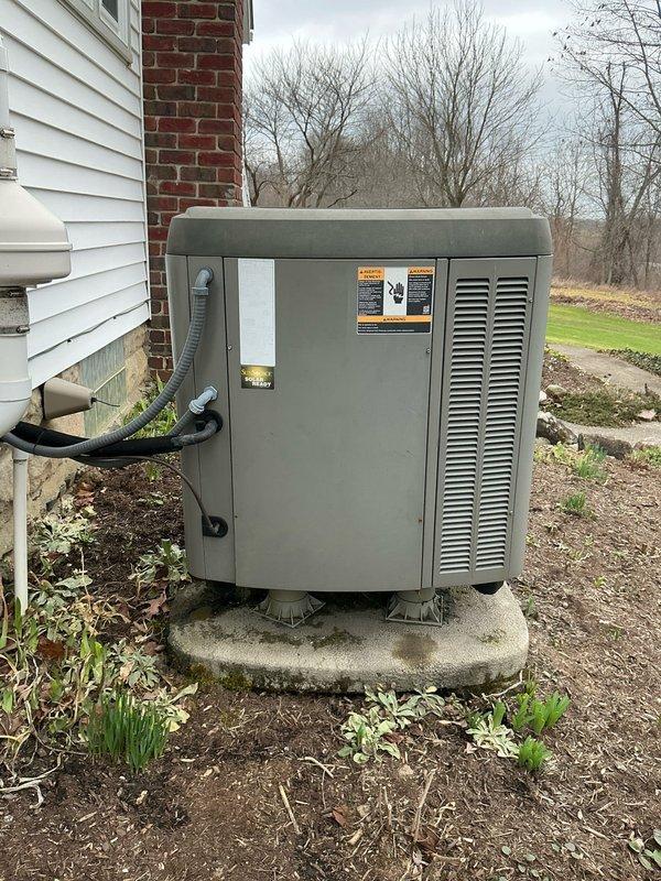 Performed evaluation of aging HVAC system including 18-year-old oil furnace and 16-year-old heat pump. Documented current equipment condition with photos showing basement-installed furnace with connected ductwork and the exterior heat pump unit mounted on concrete pad. Prepared replacement estimate for complete system upgrade.