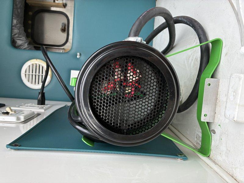 Successfully completed electrical hard-wiring installation for a replacement dog grooming dryer unit. Disconnected existing wiring from previous unit, then properly connected new dryer using appropriate wire connectors to join color-coded conductors (green, red, white, and black) within the metal housing, ensuring secure electrical connections and proper grounding.