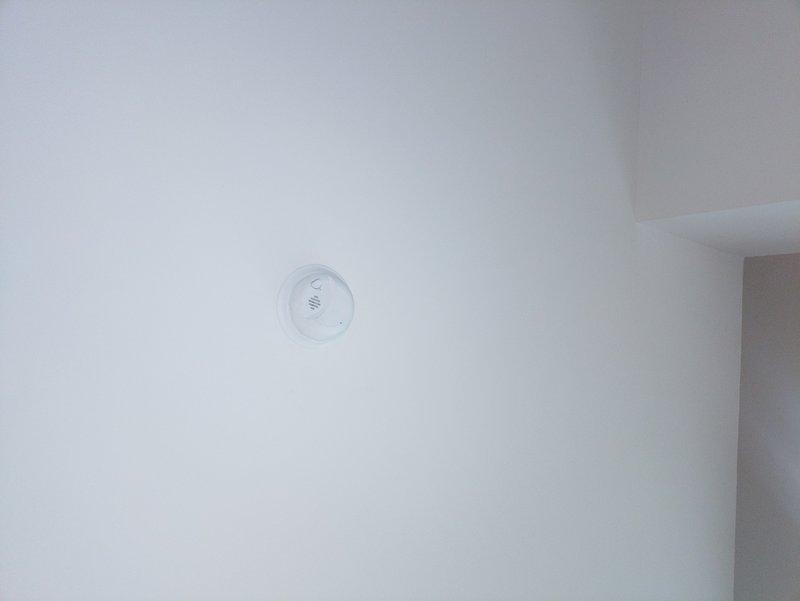 Replaced six hard-wired smoke detectors throughout the residence with new units. Verified proper installation and functionality of all detectors to ensure compliance with safety standards. All units are now operational with indicator lights functioning correctly.