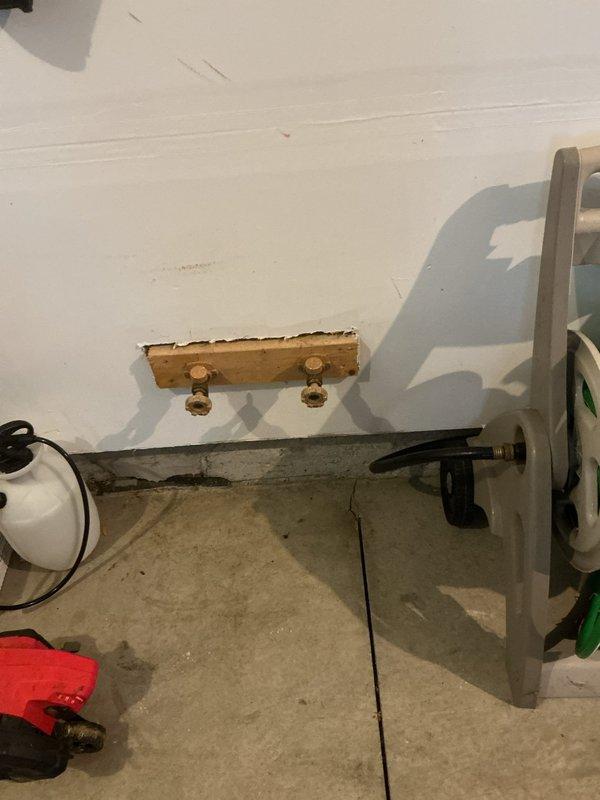 Responded to service call for non-functioning cold water supply to garage spigot. Diagnostics revealed blockage in the cold water line. Created access panel in wall to expose plumbing connections, located and cleared obstruction in the supply line. Verified proper water flow and pressure after repair. Left area clean with access panel ready for finishing.