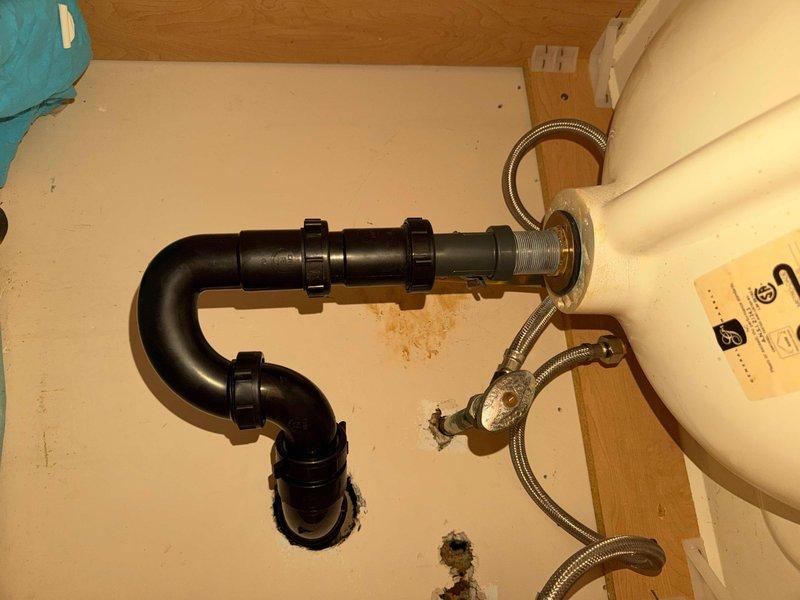 Successfully installed new lavatory faucet with complete drain assembly and P-trap replacement. Corrected previous moisture issues by ensuring proper sealing at all connection points with new fixtures. System now functions properly with no leaks observed during final testing.