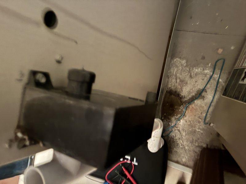 Performed routine maintenance on two 21-year-old gas furnaces installed in 2005. Inspection revealed heat exchanger with visible corrosion along the top edge, and identified exposed insulation with deterioration near electrical connections. Completed full system tune-up and recommended monitoring of heat exchanger due to age-related wear.