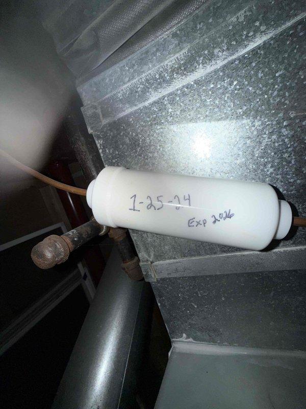 Performed scheduled MVP Heating maintenance visit. Inspected HVAC system components including filter dated 1-25-24 (expiration 2026) and verified proper installation. Examined mechanical components including L-shaped metal rod and connecting pipes, confirming all parts in normal working condition with no visible damage or corrosion.