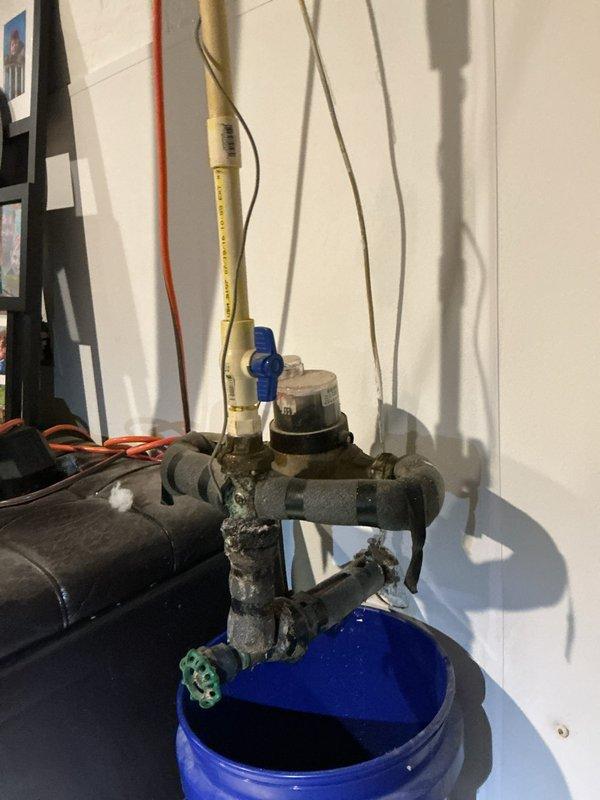 Responded to service call for a slow leak in basement main drain. Upon inspection, found mineral buildup and corrosion at pipe joints in the main drainage system. Cleared the blockage, cleaned pipe connections, and verified proper water flow with no further leakage before completing the service.