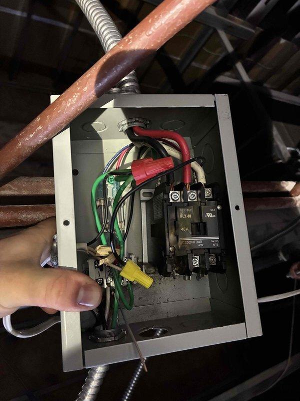 Relocated faulty sauna contractor to an accessible location and re-ran romex wiring to the heater. Inspected electrical junction box and 30A circuit breaker, replacing damaged components and securing connections with wire caps to ensure safe operation of the system.