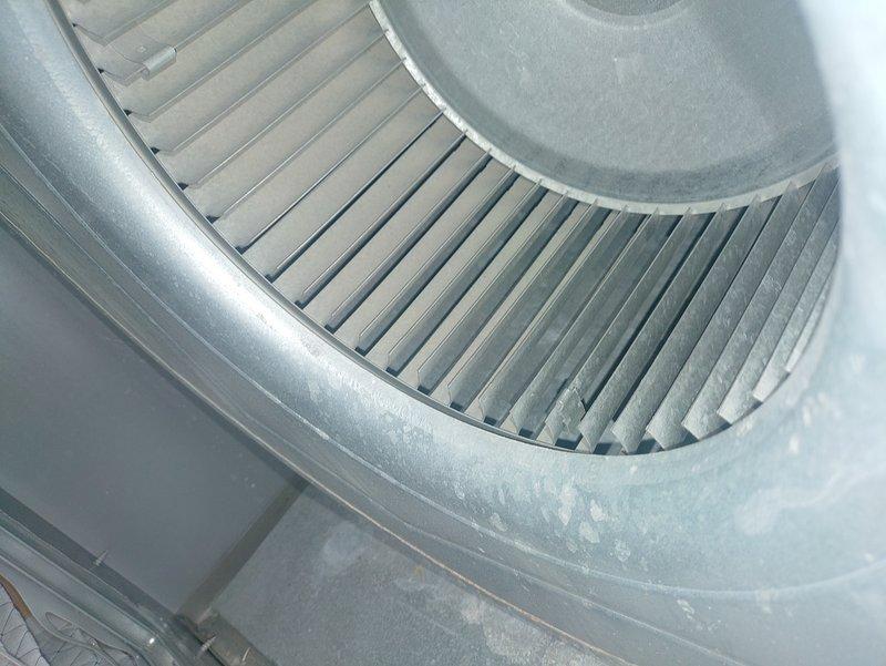 Performed routine MVP cooling maintenance service. Inspected refrigerant system components, noting "Piston" metering device with visible copper line oxidation. Examined blower wheel assembly which showed minimal dust accumulation, ensuring proper airflow operation for the cooling system.