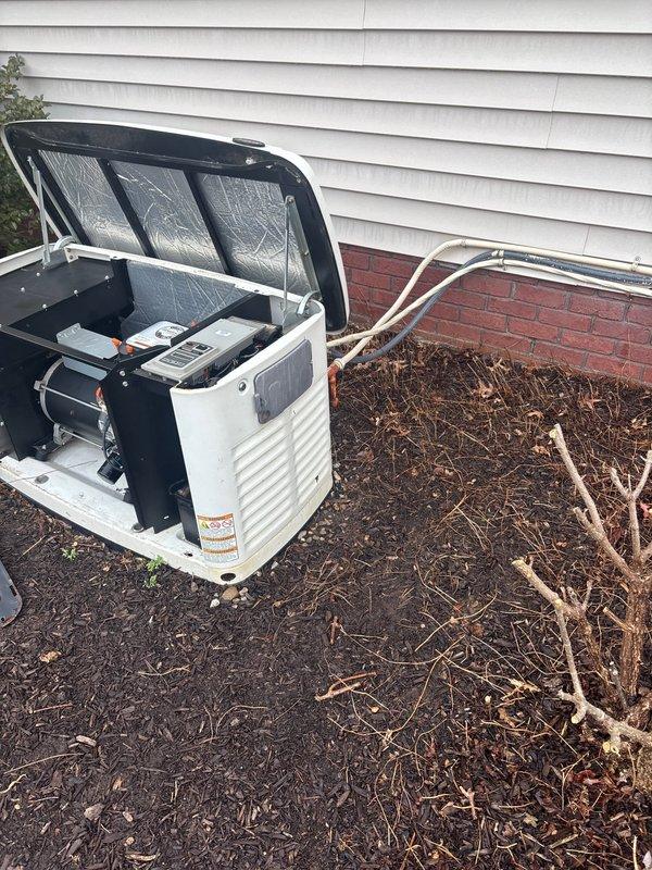 Replaced 14KW Generac standby generator with new unit, utilizing existing gas and electrical lines. Installed Genpad to elevate unit from ground and added gravel base for proper drainage. Old generator was left on-site as requested for neighbor collection.