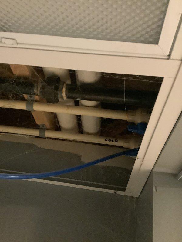 Performed comprehensive assessment of aging HVAC system requiring replacement. Inspected water damage to existing unit caused by previous well pump failure. Documented plumbing infrastructure and water heater setup in unfinished basement area with exposed wooden framing. Provided customer with furnace and air conditioning replacement estimate with installation options.