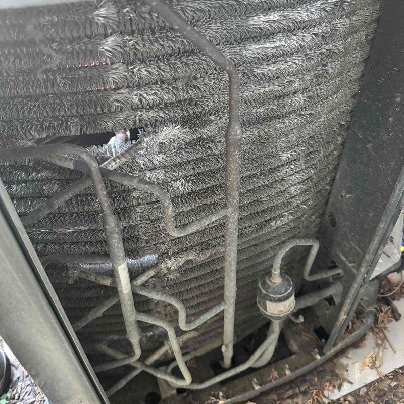 Performed scheduled MVP Cooling maintenance service. Inspected condenser unit, noting dirt accumulation on coil fins that could reduce system efficiency. Examined electrical components including capacitor and wiring connections, which were found to be in working condition despite some dust in the compartment.