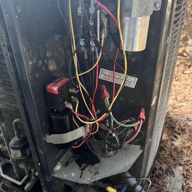Performed scheduled MVP Cooling maintenance service. Inspected condenser unit, noting dirt accumulation on coil fins that could reduce system efficiency. Examined electrical components including capacitor and wiring connections, which were found to be in working condition despite some dust in the compartment.