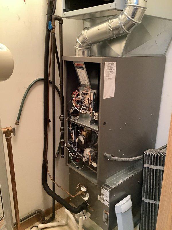 Performed comprehensive tune-up maintenance on 5-year-old furnace and AC system. Inspected internal components including control board, wiring, and motors with access panel open. Checked condensate drain lines and connection points for proper operation and cleaned accessible components.