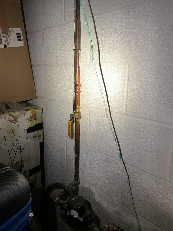 Provided customer with quotation for installation of water treatment systems including purifiers, softeners, and filters. Inspected existing plumbing setup with copper piping, brass fittings, and control wiring mounted on concrete block wall. Noted current electrical junction box configuration requires organization for proper installation of proposed water treatment equipment.