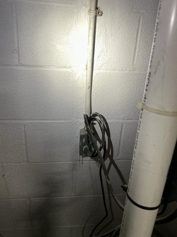 Provided customer with quotation for installation of water treatment systems including purifiers, softeners, and filters. Inspected existing plumbing setup with copper piping, brass fittings, and control wiring mounted on concrete block wall. Noted current electrical junction box configuration requires organization for proper installation of proposed water treatment equipment.