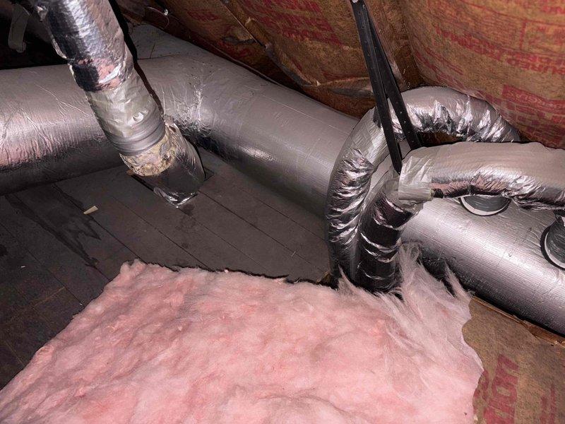 Conducted high velocity AC replacement estimate in a residential property with traditional styling. Inspection revealed existing ductwork system with insulated metal pipes wrapped in silver metallic tape and fiberglass insulation requiring assessment for compatibility with new high velocity system. Customer requires morning appointments due to professional commitments with Channel 3 news.