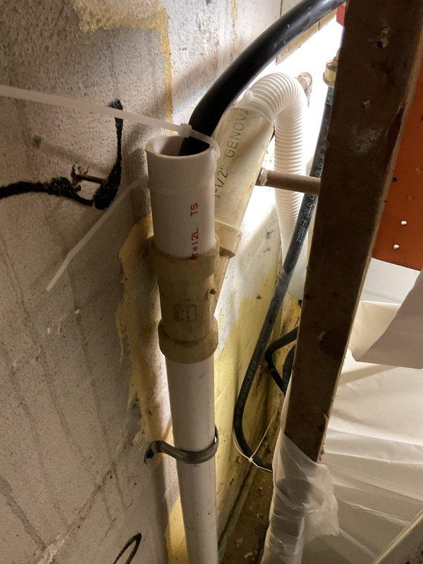Successfully replaced floor drain under concrete slab, requiring concrete removal and patching around the new PVC drain installation. Connected new drain line to existing plumbing system, securing all components with proper mounting brackets and ensuring complete drainage functionality.