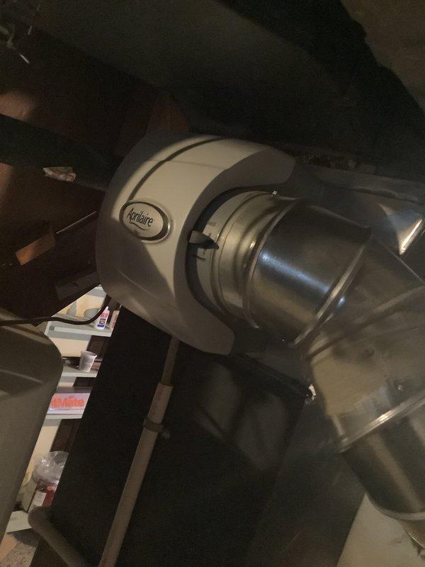 Conducted comprehensive assessment of aging HVAC system (14 years old) including existing Aprilaire humidifier installation and ductwork. Evaluated PVC condensate drainage system integrated with structural elements. Provided replacement options for complete system upgrade.
