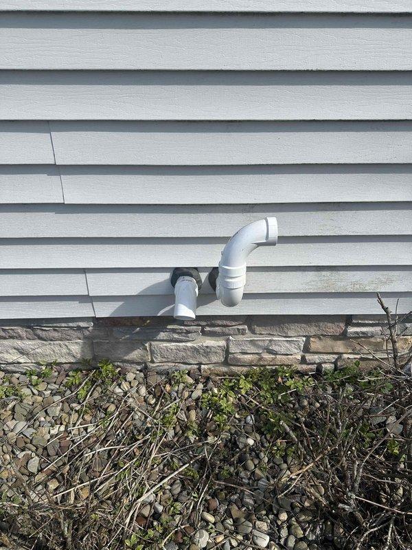 Completed installation of a 90% efficiency furnace as second phase of HVAC project. Installed proper PVC venting through exterior wall with appropriate clearances and slope. Connected condensate drainage system with code-compliant PVC piping and fittings in basement area.