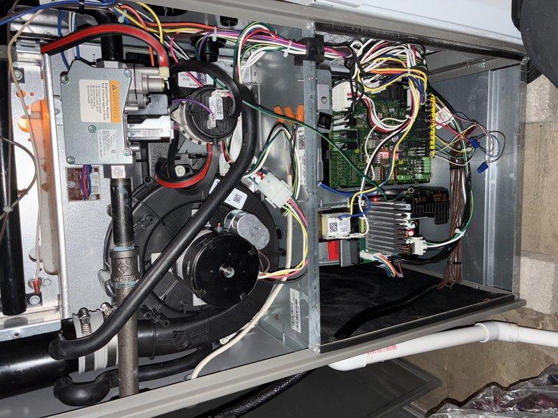 Performed scheduled MVP heating maintenance service on HVAC system. Removed access panel to inspect internal components including control board, wiring connections, and blower motor assembly. Utilized hex key tool for necessary adjustments and completed comprehensive system check to ensure proper operation for heating season.