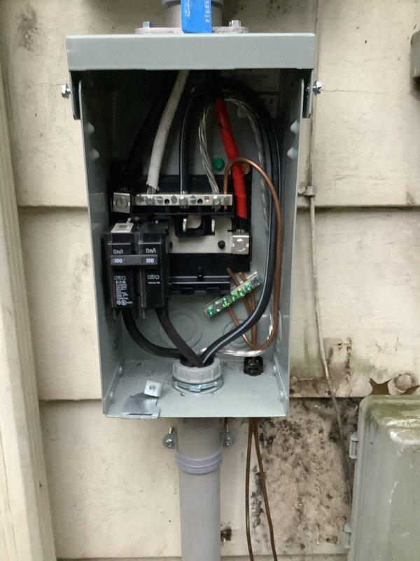 Successfully installed an emergency disconnect for electrical panel replacement as required by code. Labeled service disconnect properly, installed bonding strap to connect the GEC to the grounded service conductor, and documented the installation with photos showing the completed exterior panel mounting with proper labeling and security features.