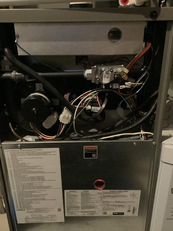 Performed scheduled furnace tune-up on 5-year-old system. Inspected all internal components including gas valve assembly, wiring harnesses, and ventilation system; all found in normal working condition with no visible damage or anomalies. Diagnosed and verified Aprilaire humidifier operation - unit is functioning correctly at 43% humidity with "Humidifier On" indicator illuminated.