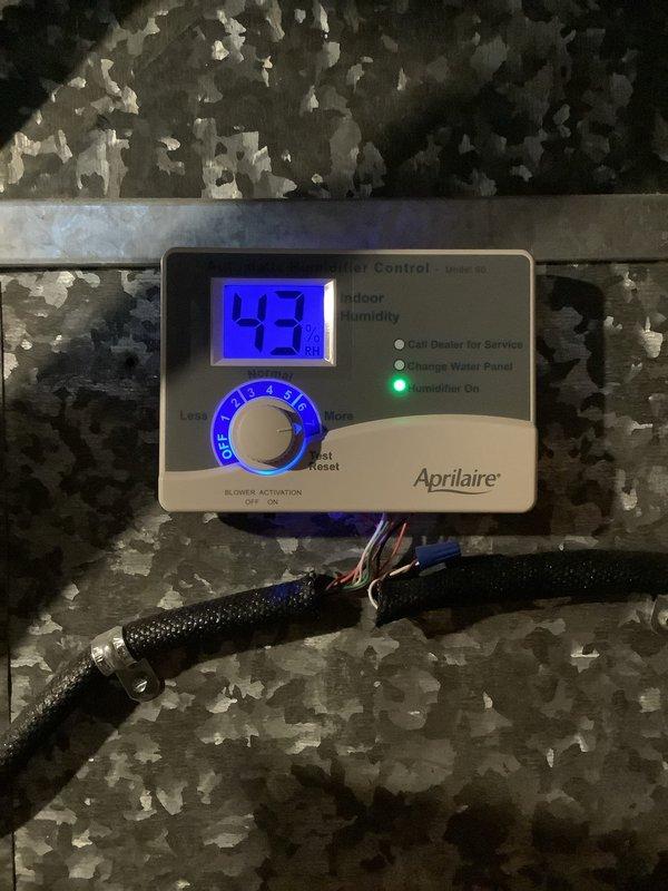 Performed scheduled furnace tune-up on 5-year-old system. Inspected all internal components including gas valve assembly, wiring harnesses, and ventilation system; all found in normal working condition with no visible damage or anomalies. Diagnosed and verified Aprilaire humidifier operation - unit is functioning correctly at 43% humidity with "Humidifier On" indicator illuminated.