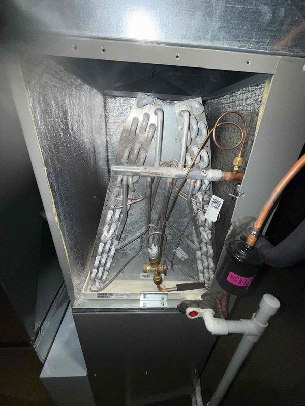 Performed scheduled maintenance visit on Lennox residential cooling system. Inspected outdoor condensing unit for visible damage (none found) and examined interior evaporator coil assembly, which showed normal wear but no operational issues. System appears to be functioning properly with all components intact and properly connected.